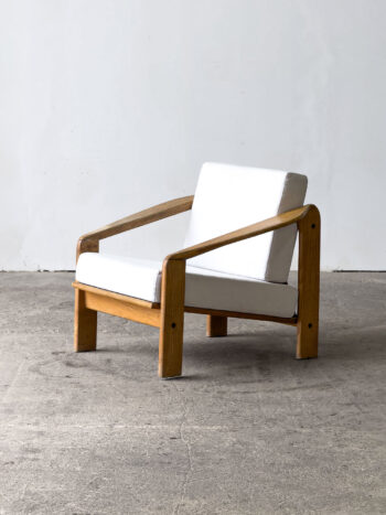 Fotel Zenona Bączyka, ŁAD, lata 70., dębowa konstrukcja, jasna tapicerka